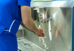 Doctor washing hands. Surgeon washing hands before operating