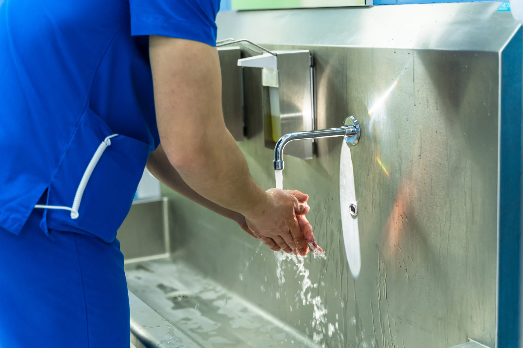 Doctor washing hands. Surgeon washing hands before operating - NanoSlic ...